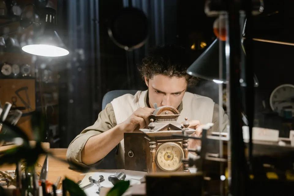 A jeweller at a workbench — stand-in photograph