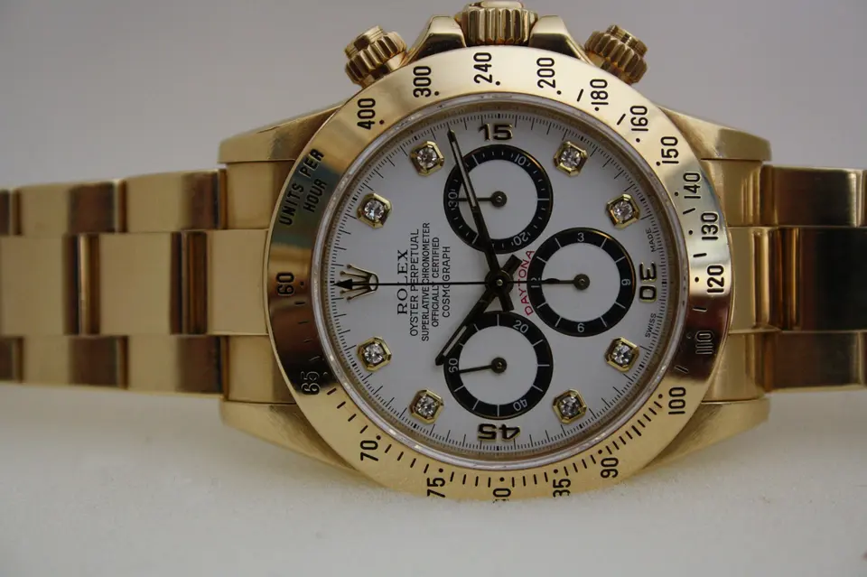 18K yellow gold Rolex Cosmograph Daytona ref. 16528 with white dial and diamond hour markers — stand-in photograph